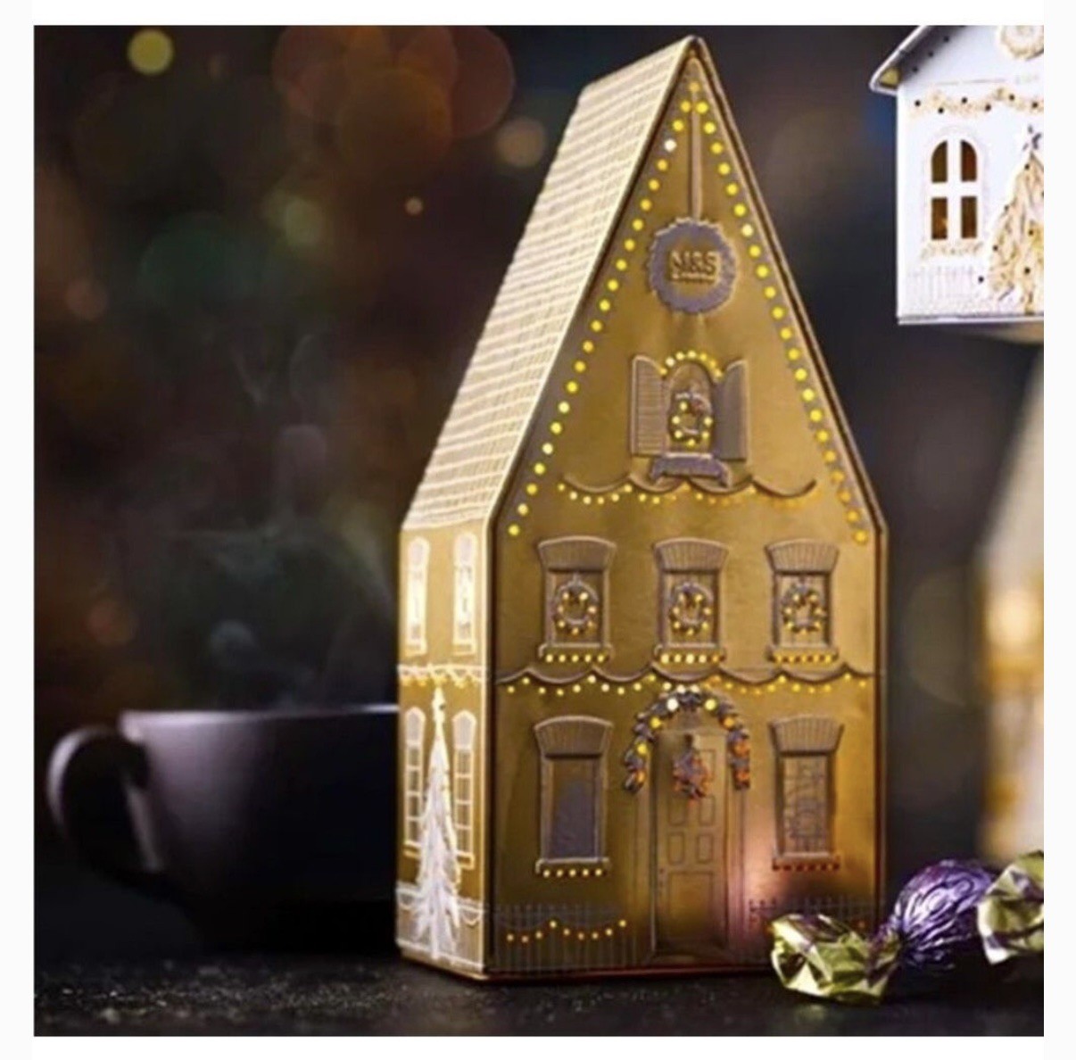 2 M&S Tea Light Up House Tin, 40 tea bags in each tin. Expiration 12 20 2026.