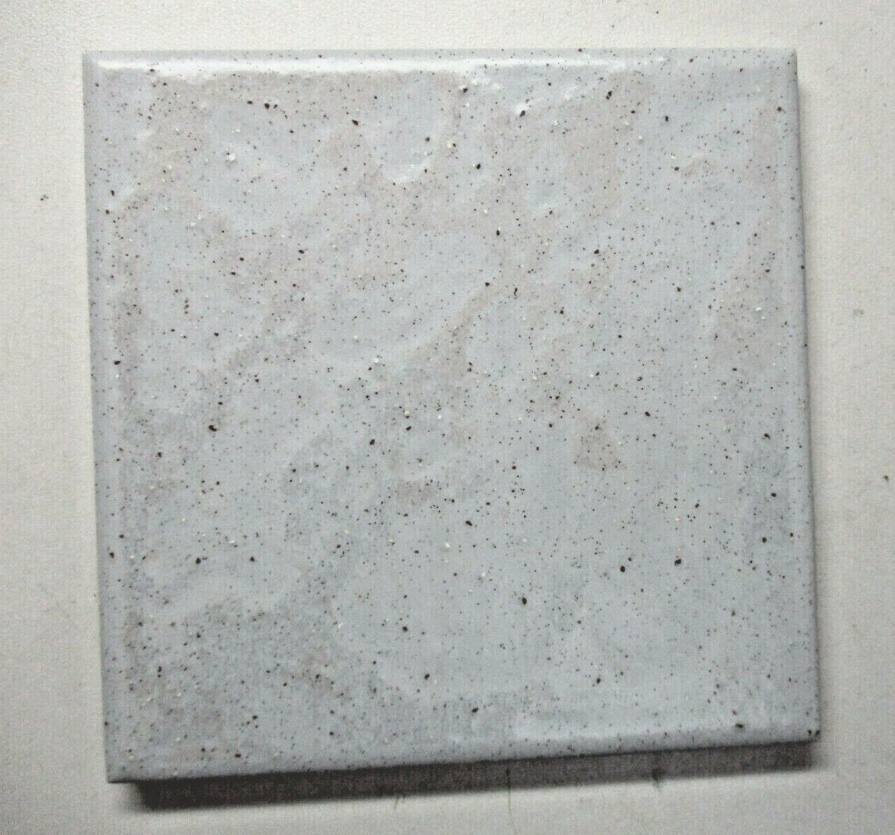 1 Tile interceramic 4-1/4″sq Satin Brown Speckles on Pale Gray Wrinkled Wall MCM