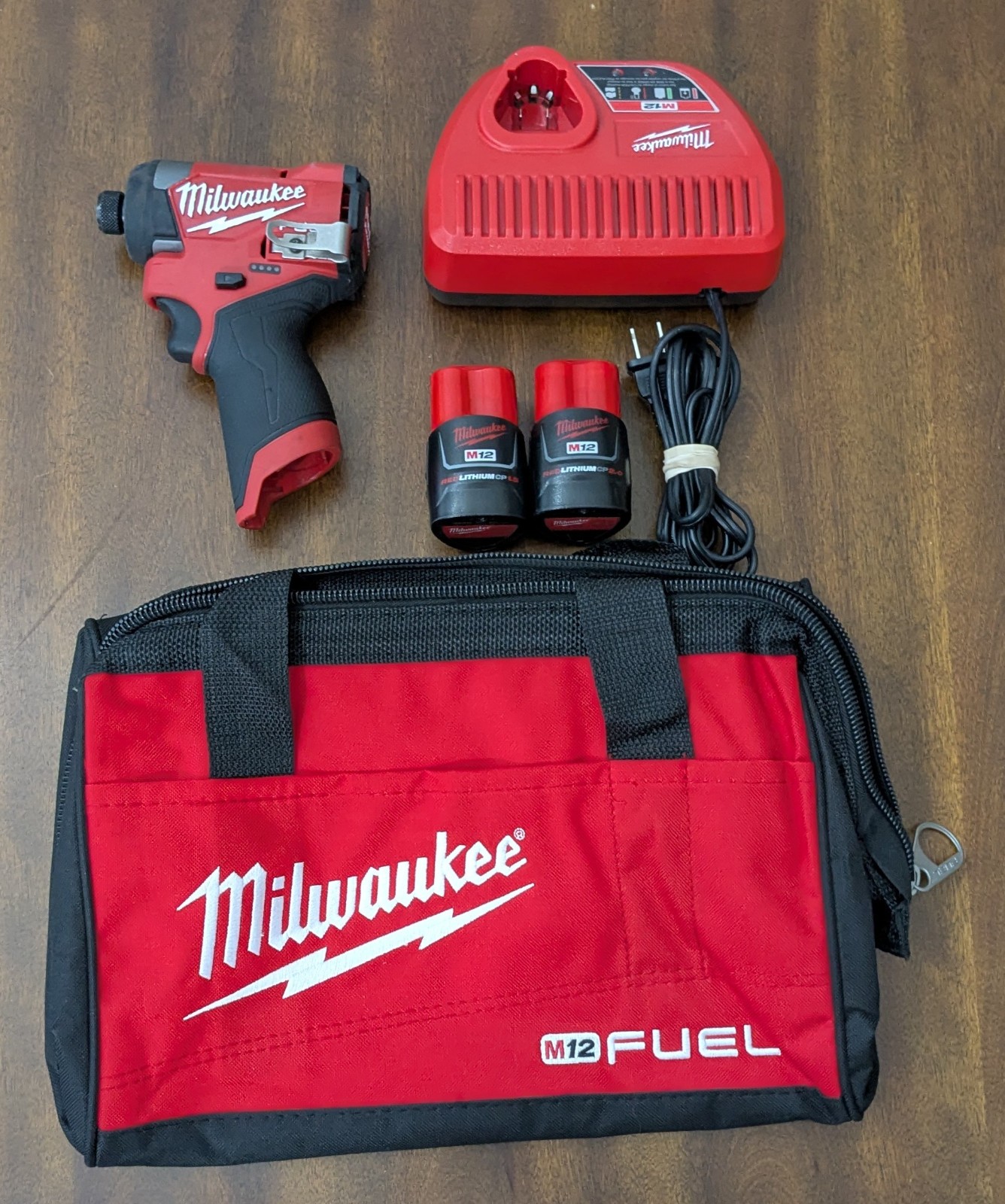 Milwaukee M12 Fuel 1/4in Hex Impact Driver Red 3453-20 + bag 2 battries &charger